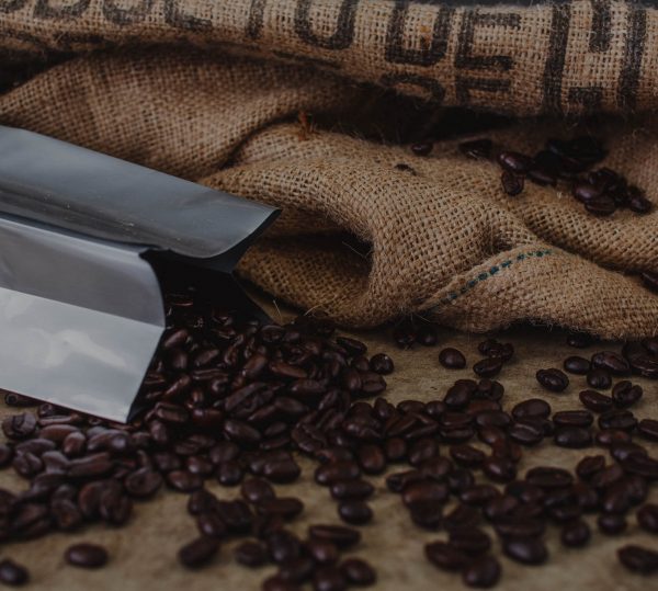 bag laying on side with coffee beans spilling out